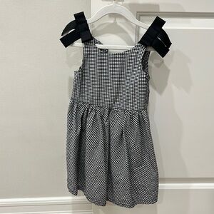 Black and white girls dress with bow straps. Size 4